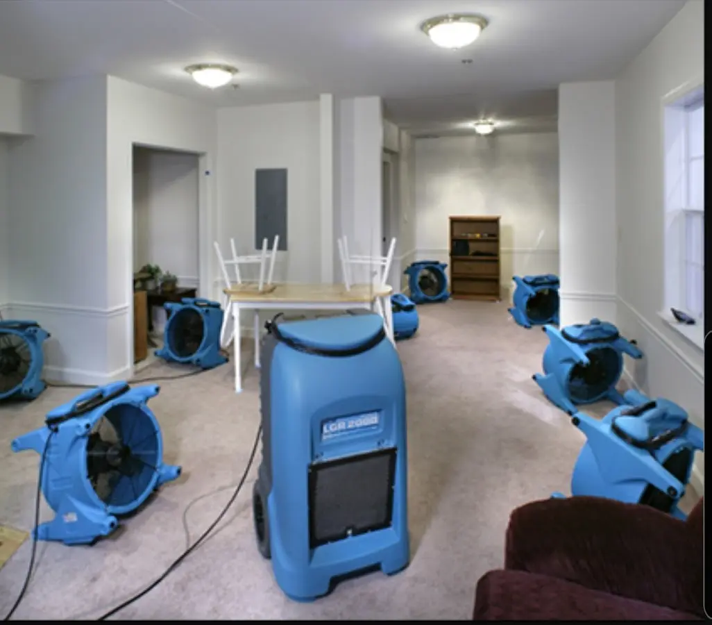 Air movers and dehumidifier setup for Water Damage Restoration in Harvard